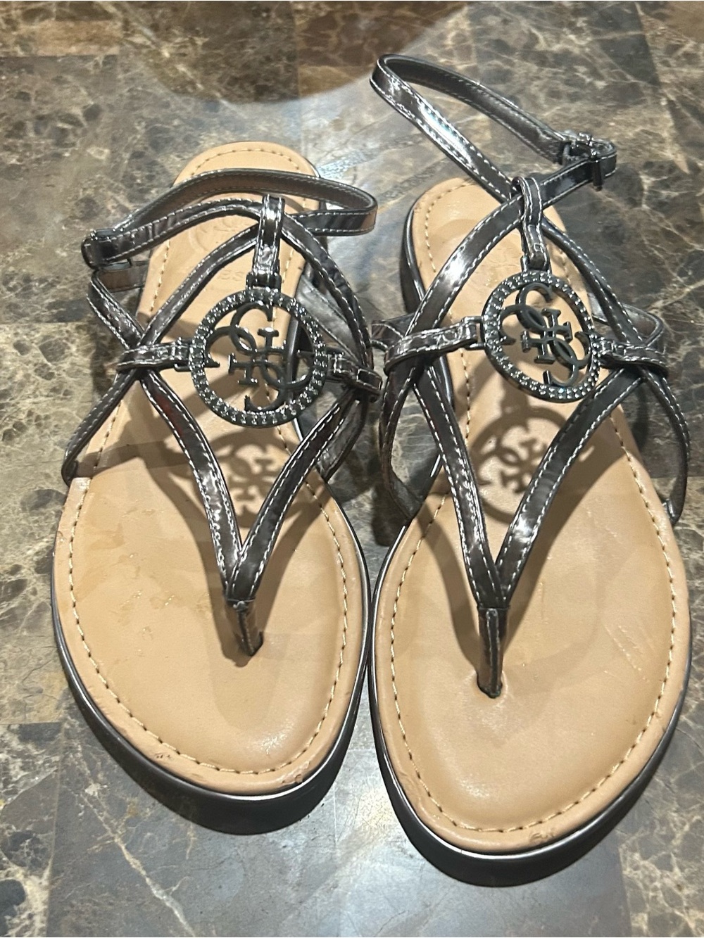 Guess Women’s Metallic Gray T-Strap Sandals